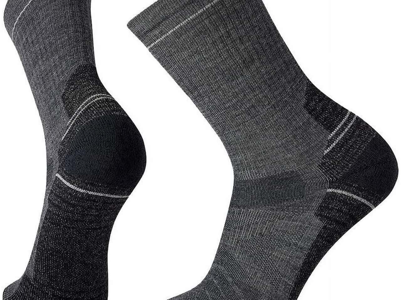 Pair of dark gray Smartwool crew socks with light cushioning and black reinforced heels and toes