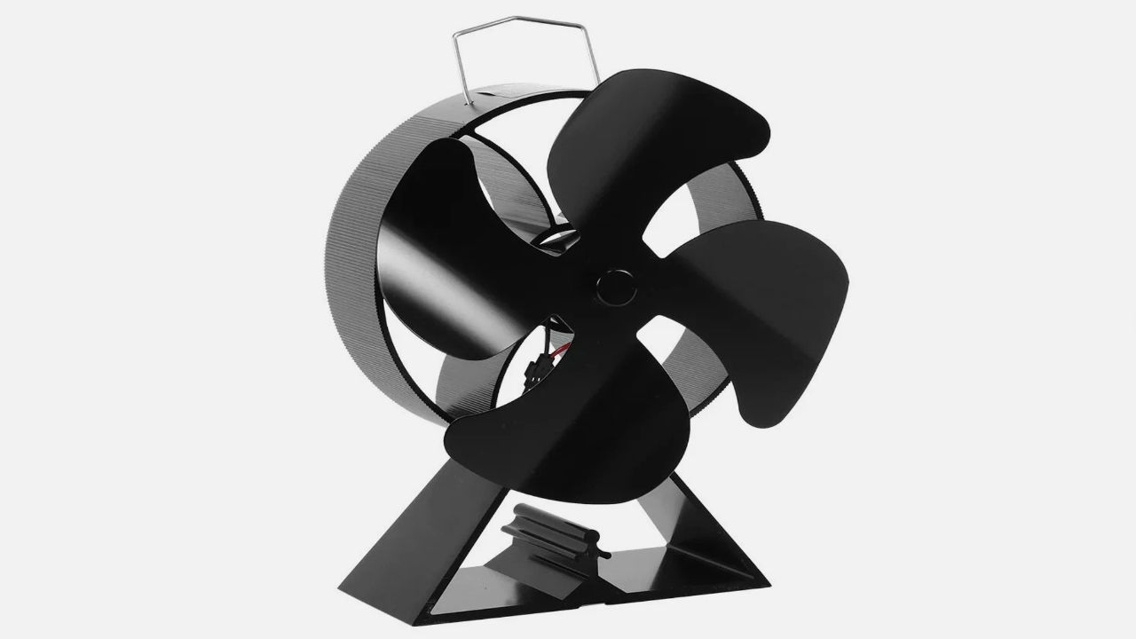 Black heat-powered eco fan with four blades and a triangular base, designed for use on wood stoves